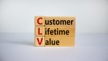 Concept words 'CLV, customer lifetime value' on cubes and blocks on a beautiful white background. Business concept. Copy space.