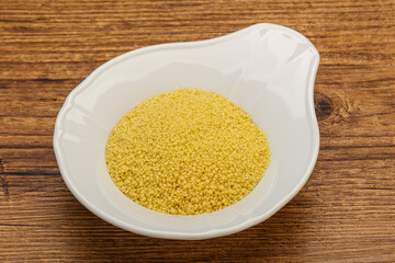 Raw cous cous heap in the bowl