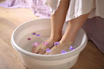 female feet in spa bowl