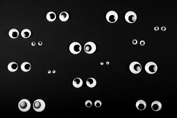 several eye couples on black background