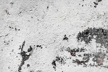 Texture of a concrete wall with cracks and scratches which can be used as a background