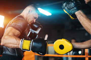 two muscle boxers sport man training and fighting on boxing ring at gym