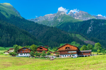 Fototapeta na wymiar Mountain valley village landscape in Venediger alps . Mountain green valley village view austria near matrei in osttirol