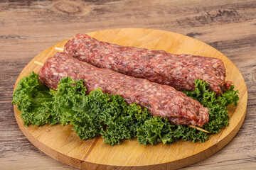 Raw minced beef kebab skewer