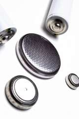 Battery group of different types and sizes on a white background