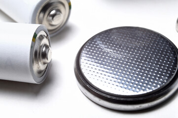 Battery group of different types and sizes on a white background