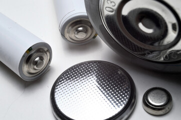 Battery group of different types and sizes on a white background