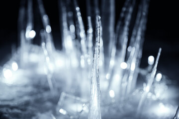 close up icicle in snow at dark night