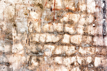 Texture of a brick wall with cracks and scratches which can be used as a background