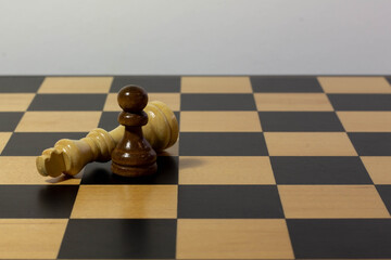 Closeup shot of black and white chess pieces on chessboard