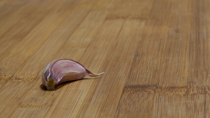 Closeup shot of a garlic on a wooden table