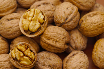 Some walnuts on dark table