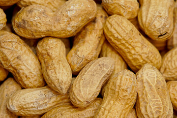 A lot of peanuts on dark table