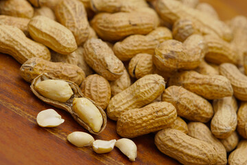 A lot of peanuts on dark table