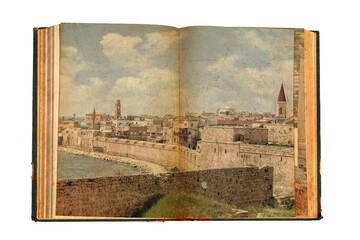 Old open book. Ancient arab city of Acre (Akko). View on historical fortification. Mediterranean, Israel.  Image designed on the old paper textured pages in vintage style. Isolated on white