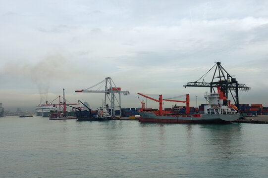 view of Barcelona port with harbour cranes and ruise ship. Barcelona, Spain