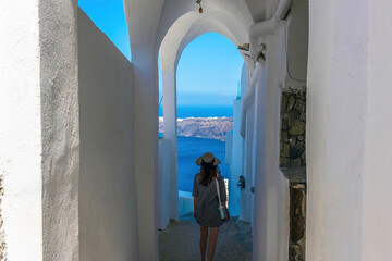 Descending from the village of Imerovigli, Santorini towards the path leading to Skaros Rock in...