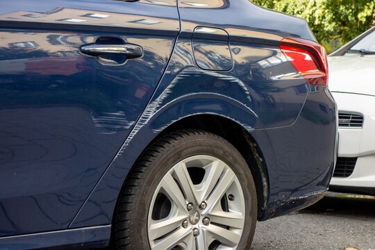 Scratches on a rear mudguard of Peugeot 301 car made by careless parking