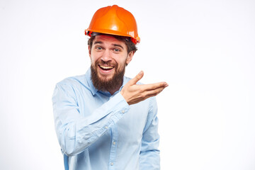 Emotional man in blue shirt orange helmet industry security Professional
