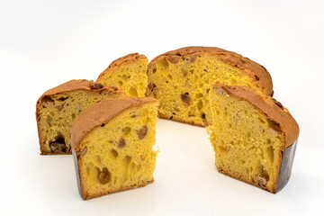 Panettone with marron glace, cut slices of the typical Italian dessert for Christmas from Milan, isolated on white