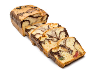 Slices of Romanian sponge cake with cocoa, turkish delight and raisins