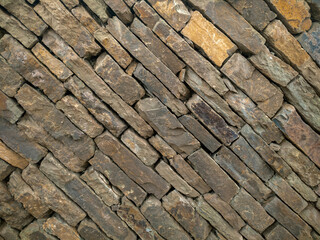 Stone texture background, copy space. Detail of stone abstract background, free space. Decorative uneven cracked stone wall surface