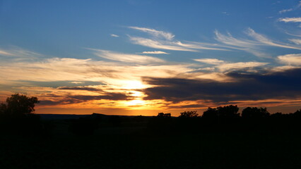 Sunset in the field with clouds