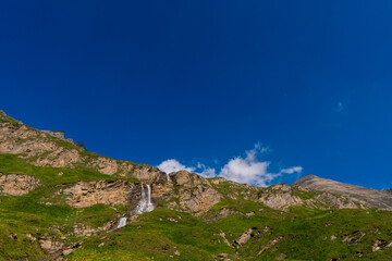 Fototapeta na wymiar The beautiful view of mountain nature with lake in Glockner alps europe- taken from The Grossglockner High Alpine Road - Grossglockner Hochalpenstrasse