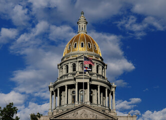 View To The Shimmerig Golden Dome Of The Colorado State Capitol In Denver On A Sunny Summer Day With A Clear Blue Sky And A Few Clouds