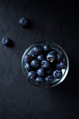Bilberries on dark background. Top view. Close up. 