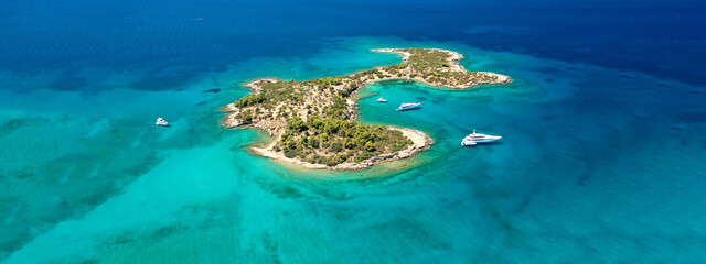 Aerial drone ultra wide photo from paradise bay and small island of Chinitsa near famous Porto Heli, Argolida, Peloponnese, Greece