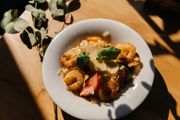 shrimp salad on a black background with beautiful shadows. Top view