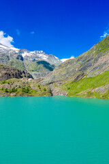 The beautiful view of mountain nature with lake in Glockner alps europe- taken from The Grossglockner High Alpine Road - Grossglockner Hochalpenstrasse