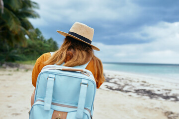 Woman tourist backpack travel to vacation beach exotic 