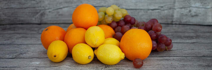 Bright fruits lie on the table. Vitamins.