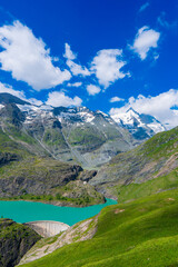 The beautiful view of mountain nature with lake in Glockner alps europe- taken from The Grossglockner High Alpine Road - Grossglockner Hochalpenstrasse