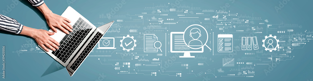Poster document management system concept with person using a laptop computer