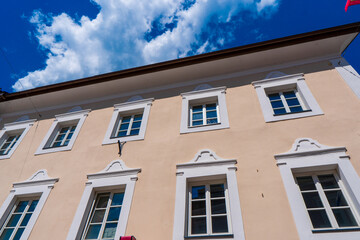 Facade of an old Dutch house in Nijmegen with a little balcony and a lot of flowers with vintage filter