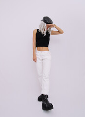 Urban Blonde Girl in studio. Trendy casual denim look. Stylish platform boots. Fashion lookbook concept
