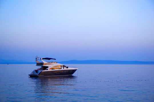 Image of a luxurious yacht on th ocean. Sunset colours 