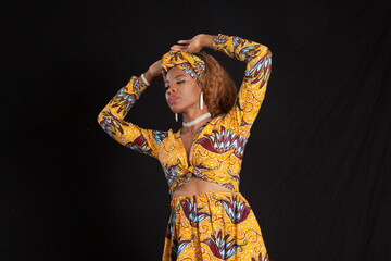 Obraz na płótnie Canvas Pensive woman in African Dress