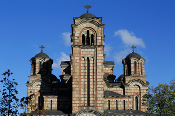 Front view of St. Mark's orthodox church, located in Tasmajdan park, during a beautiful sunny day in Belgrade, Serbia.