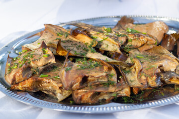 Tray full of smoked flounder with dill. Healthy catering service buffet table at a summer party.
