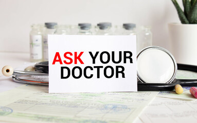 ASK YOUR DOCTOR Text, On Background of Medicaments Composition, Stethoscope.