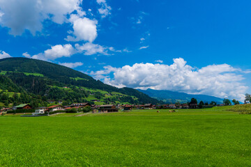 Fototapeta na wymiar Green valley village landscape. Mountain green valley village view. Mountain valley village landscape. Austria alps europe