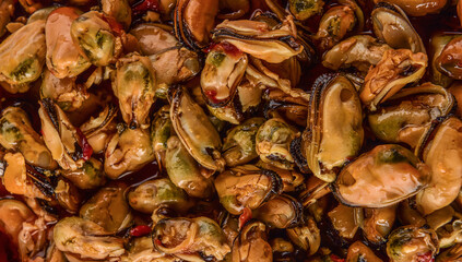frozen mussels, in oil and marinade. Textures from delicious seafood