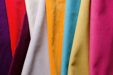 Bright collection of colorful velour textile samples. Fabric texture.