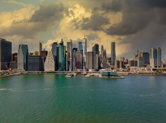 Naklejka premium Dusk at lower Manhattan skyline on the East River at New York, New York, USA