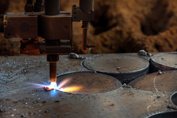 Cnc plasma cutting machine is cutting to steel plate. A Cnc plasma system is a machine that carries...