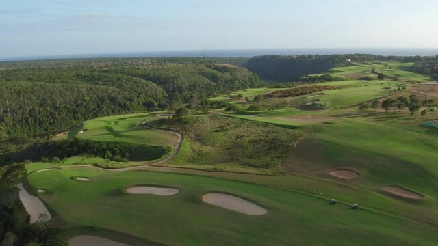 Golfers at Dye Fore club, Altos de Chavon. Aerial top view